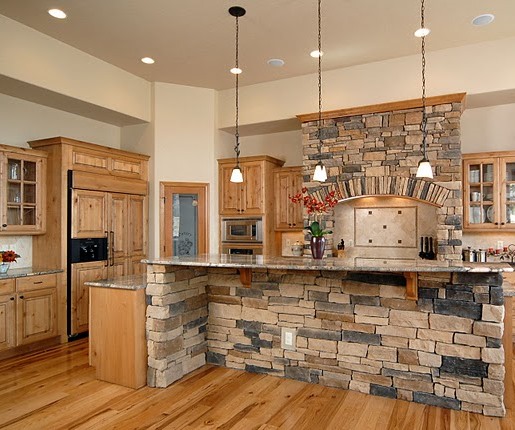 mountain chic kitchen with natural stone and rustic wood cabinets