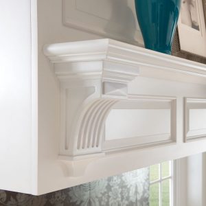 Custom kitchen range hood with decorative corbel shelf