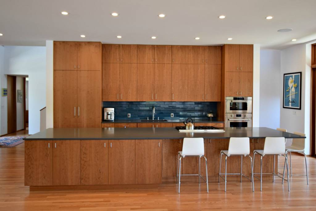 Contemporary kitchen with alder slab cabinets