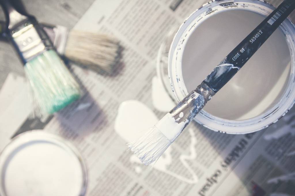 Paint cans and paintbrushes