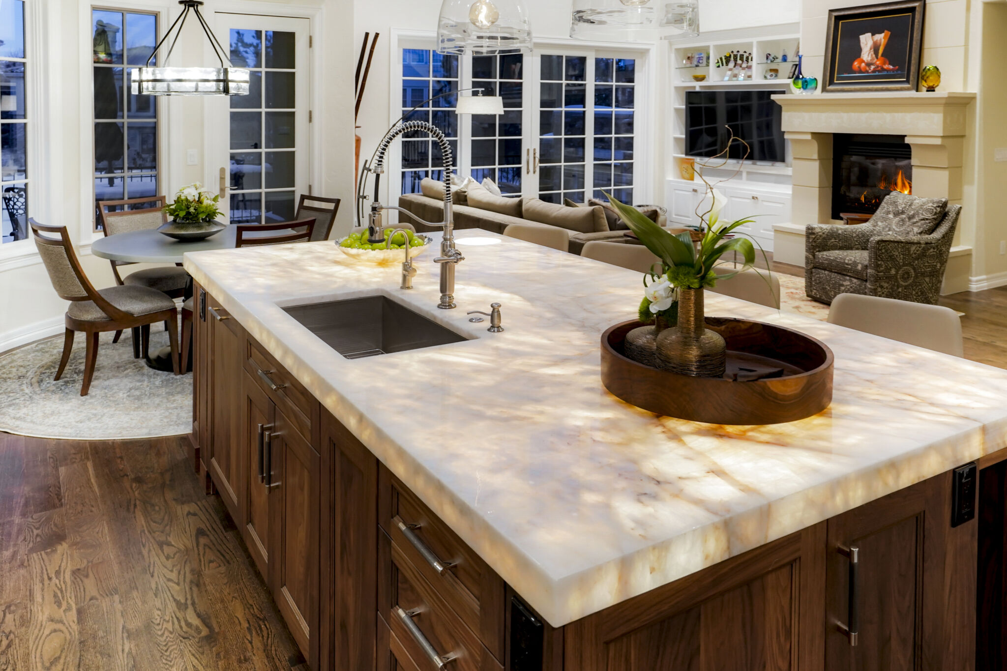 Remodeled kitchen with white Shaker cabinets and underlit countertops