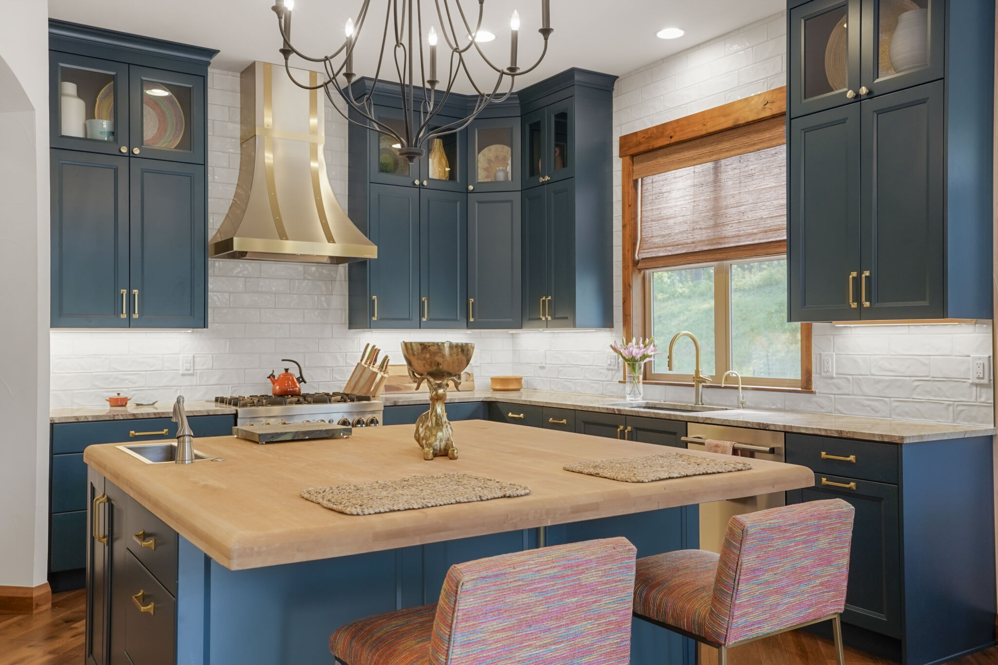 Kitchen remodel featuring teal painted cabinets and butcher block island top
