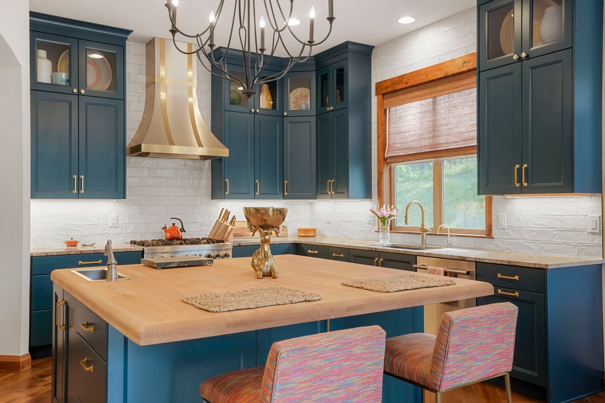 Kitchen remodel featuring teal painted cabinets and butcher block island top