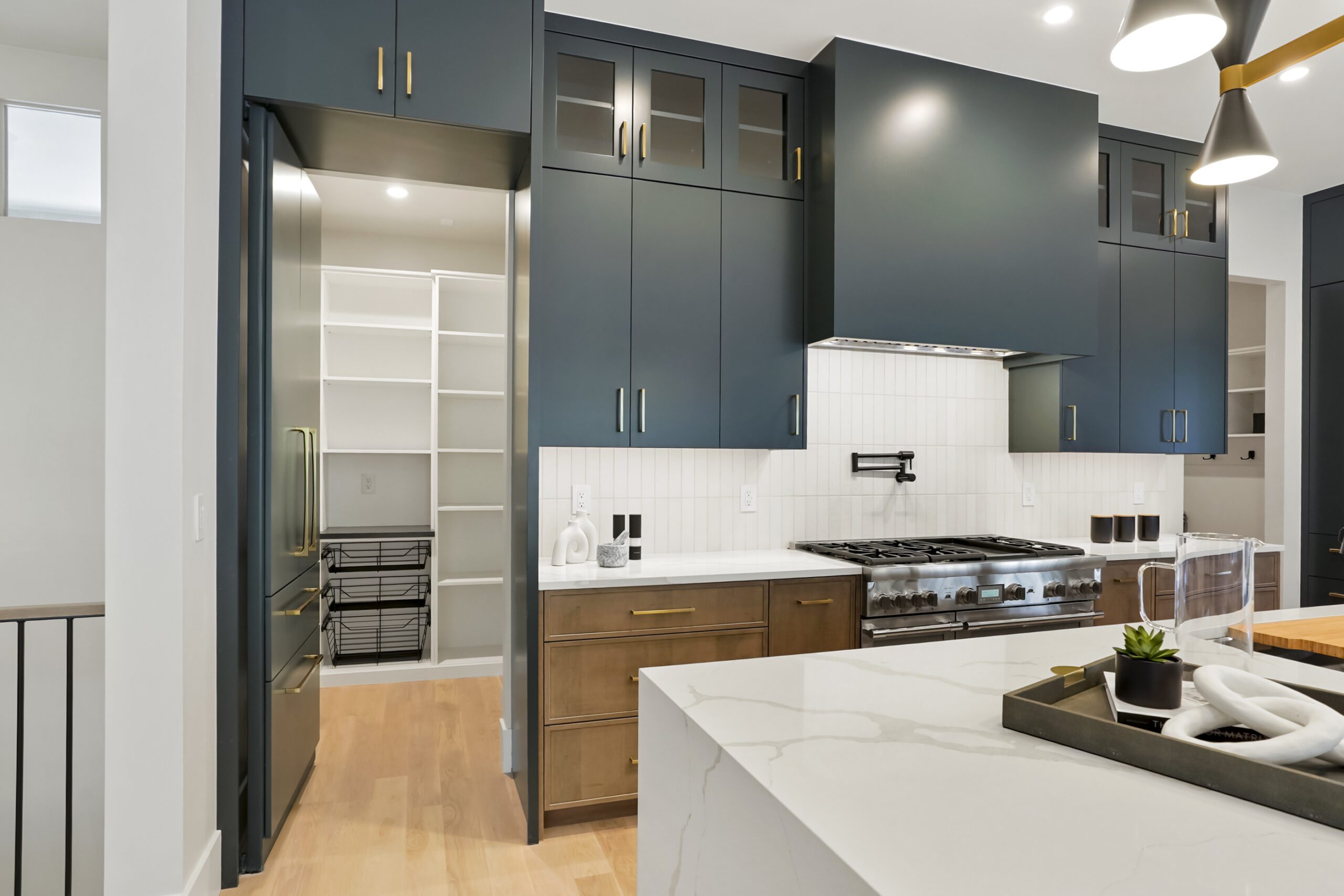 Modern kitchen with walkthrough pantry storage