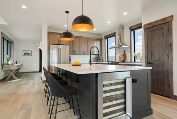 Mountain home with rustic beech cabinets and a large center island